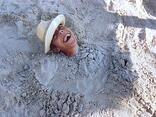 A picture of Mike Loepfe enjoying life in the sand